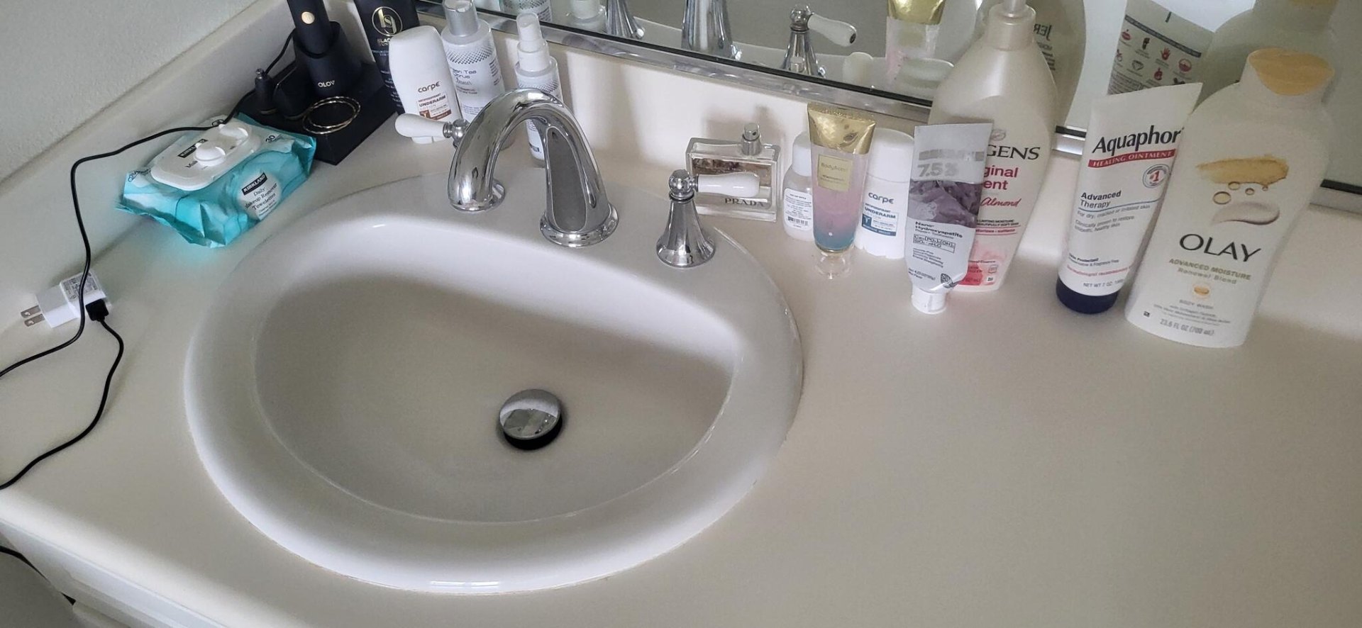Vanity countertop declutter — before